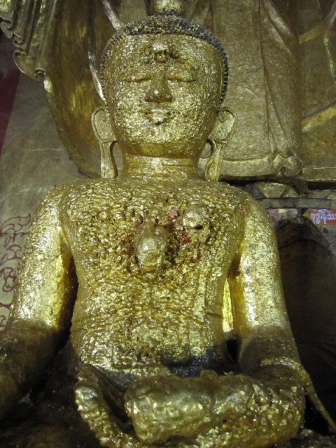 Buy a little gold leaf and stick it on the Buddha, for luck, for health.